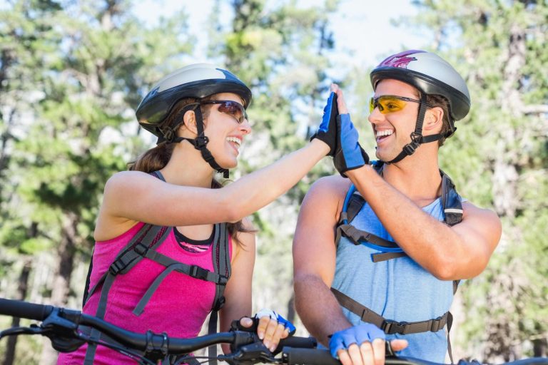couple wearing bicycle gloves while on adventure